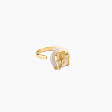 Gold-plated sculptural ring featuring a baroque pearl wrapped in a delicate rose and vine cage design