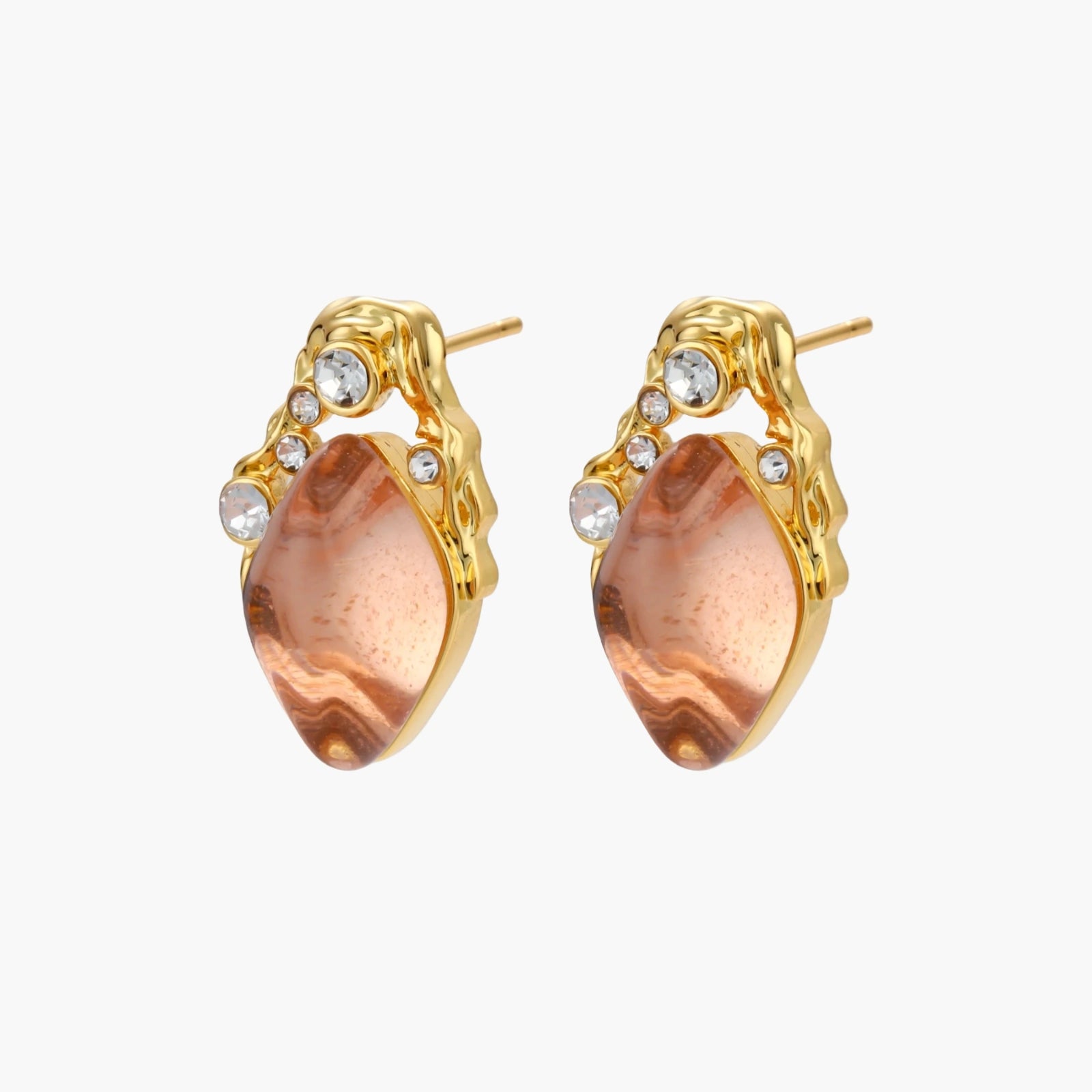 Gold-plated baroque stud earrings with coral-pink liuli stones and cubic zirconia crystals on white background.